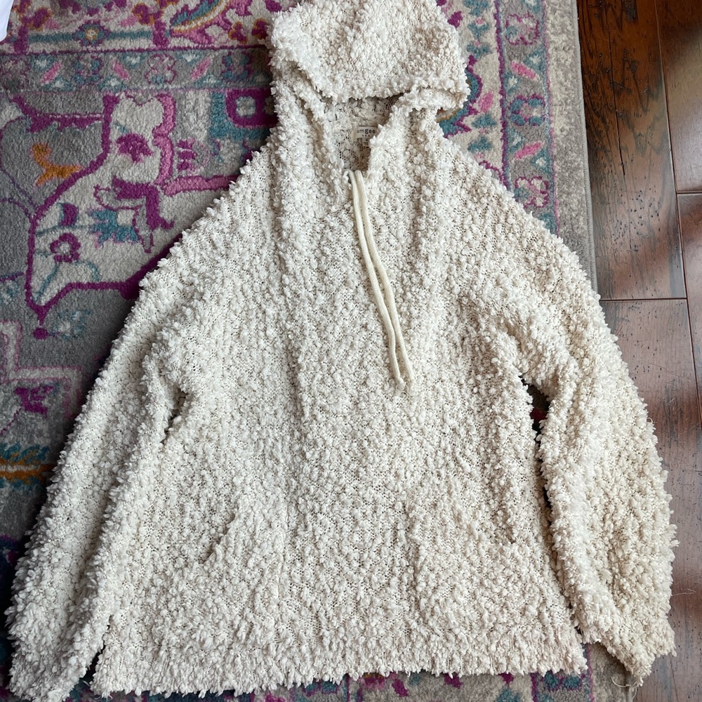 Oversized sherpa-like hoodie.